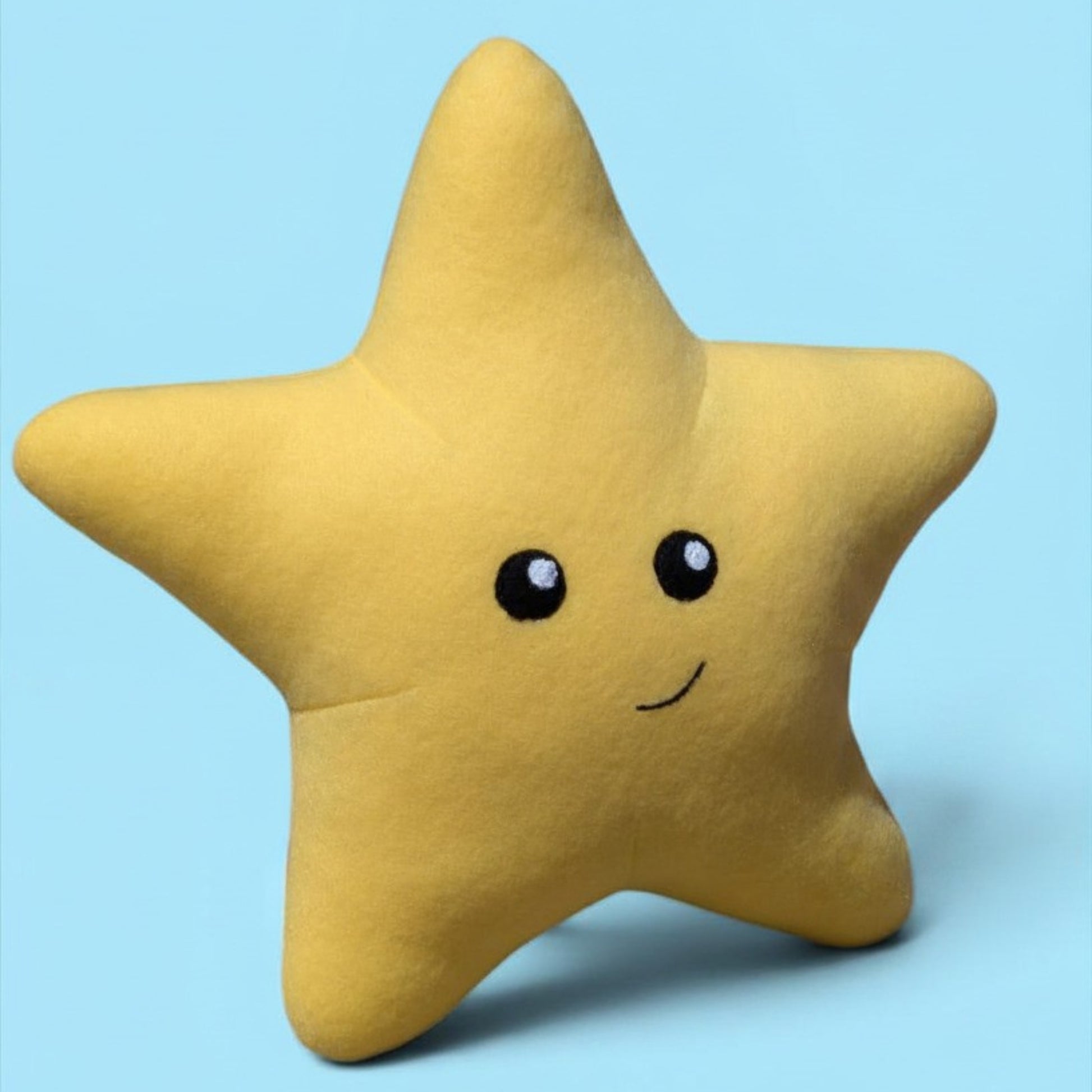 A yellow star-shaped plush stuffed animal with a cute felt and paint face, set against a solid light blue background.